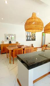a dining room with a table and chairs at Bingin Pura Vida Villas in Uluwatu