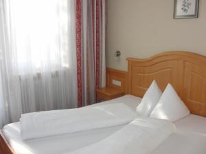 Postel nebo postele na pokoji v ubytování Gästehaus Loithaler