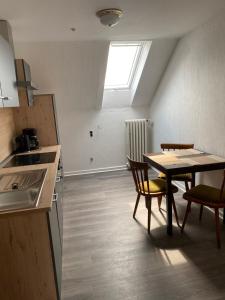 Kuchyň nebo kuchyňský kout v ubytování Bistro-zur-Quelle
