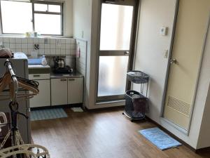 Kuchyň nebo kuchyňský kout v ubytování Imazato Ryokan