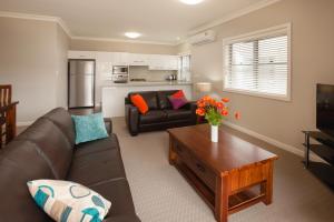 a living room with a couch and a table at Hamilton on Everton in Newcastle