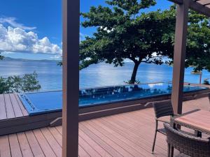 a swimming pool on a deck with a view of the water at Premium Villa Miyagijima - Vacation STAY 06499v in Uruma