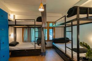 Postel nebo postele na pokoji v ubytování Nomads Hostel