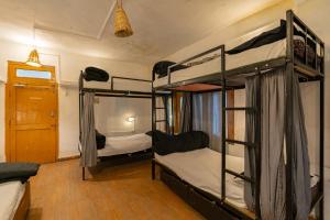 Postel nebo postele na pokoji v ubytování Nomads Hostel
