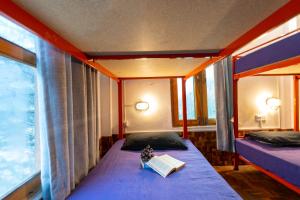 Postel nebo postele na pokoji v ubytování Nomads Hostel
