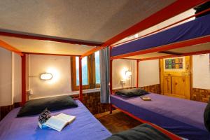 Postel nebo postele na pokoji v ubytování Nomads Hostel