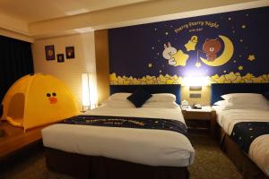 Kama o mga kama sa kuwarto sa Fullon Hotel LihPao Resort