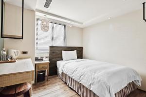 Katil atau katil-katil dalam bilik di Lan Kwai Fong Garden Hotel