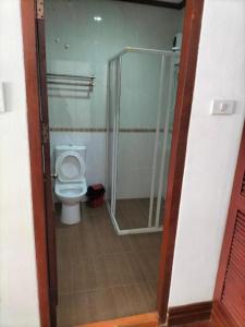 a bathroom with a toilet and a shower stall at DaViKa Hotel in Vientiane
