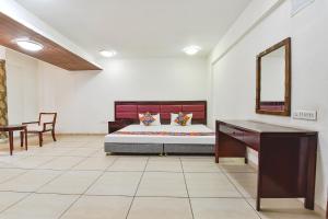 Postel nebo postele na pokoji v ubytování FabHotel GL Residency - Satellite