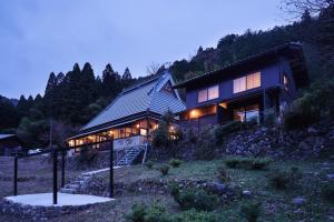 a house on the side of a mountain at 京都ミヤマシキテイ in Nantan city