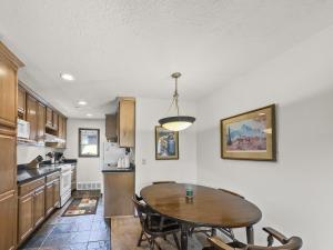 a kitchen with a table and a dining room at CC43 Chateau Claire condo in Dillon