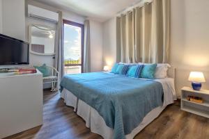 Posteľ alebo postele v izbe v ubytovaní Sardinia Guest House