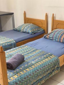 Postel nebo postele na pokoji v ubytování Tirana City Rooms - Vatra e Lagjes by Paymán Club