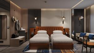 Ramada Encore by Wyndham Indore Nipania客房内的一张或多张床位