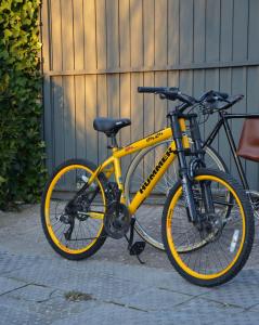 a yellow bike parked in front of a building at Hotel Nuevo Parranda in Camariñas