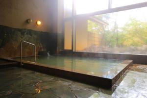 a large pool of water in a building at hokkein-onsen kougen-terrace in Kokonoe