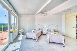 Ein Bett oder Betten in einem Zimmer der Unterkunft Ideal Property Mallorca - Villa Anna