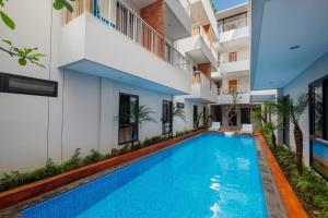 an image of a swimming pool in a building at Aralea Coliving in Denpasar