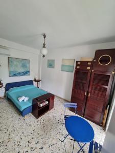 a bedroom with a bed and a table and chairs at My Room Roma 2 in Lido di Ostia
