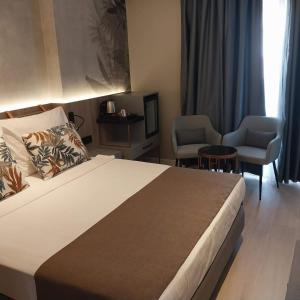 Postel nebo postele na pokoji v ubytování Alessia Hotel
