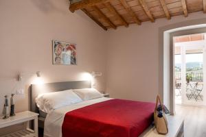 Postel nebo postele na pokoji v ubytování Podere n.8 Bio Casale Maremma