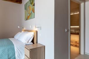 Postel nebo postele na pokoji v ubytování Podere n.8 Bio Casale Maremma