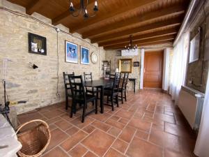 a dining room with a table and chairs at Casa Tincana in Bebbio