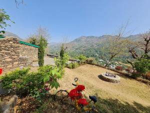 a bike parked on the side of a hill at Hostel Hideout in Bhīm Tāl