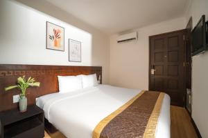 Postel nebo postele na pokoji v ubytování Zenta Beach View Hotel