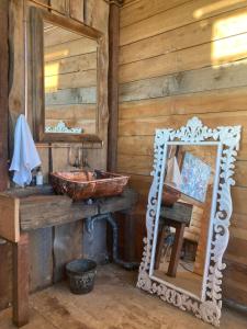 a bathroom with a sink and a mirror at Infinity at Enfin Estate in Nottingham Road