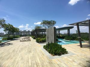 a pool on the roof of a building at Eco Kanvas Soho Suites in Cyberjaya