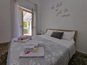 a bedroom with a bed with two towels on it at Meraviglia d'Otranto in Otranto