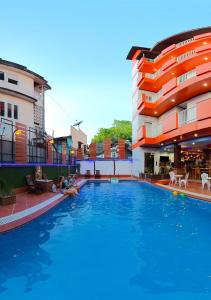 a large swimming pool in front of a building at Nana Vientiane Hotel in Vientiane