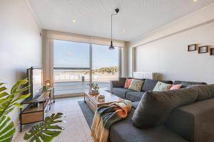 Beachfront apartment in Zeebrugge tesisinde bir oturma alanı