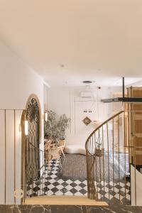 a room with a staircase and a living room at Castelar Palace & SPA by Seaward Suites in Villajoyosa