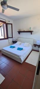 Cama ou camas em um quarto em Casa La Pelosa