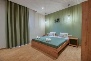 Postel nebo postele na pokoji v ubytování Ariadni Apartments Dassia