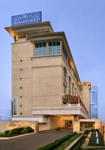 a building with a sign on the side of it at Majestic Court Sarovar Portico in Navi Mumbai
