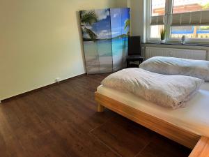 Postel nebo postele na pokoji v ubytování Fischerbalje Bantje Wohnung 1