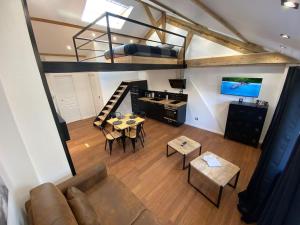 a view of a living room with a loft at Loft: Le New-York in Rouen
