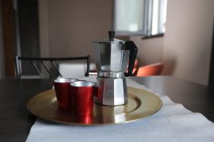 Příslušenství pro přípravu čaje a kávy v ubytování Hotel Residence Aurora