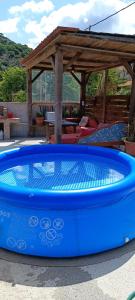 a large blue tub sitting next to a gazebo at Dream House in Perivólia