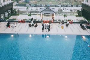 an overhead view of a group of people standing next to a pool at Hải Đăng Homestay - Hạ Long in Ha Long