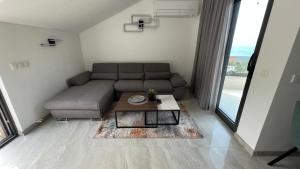 a living room with a couch and a coffee table at Vito in Gradac
