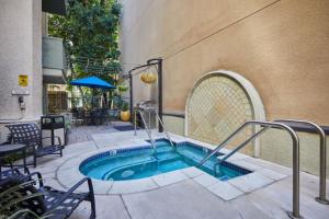 a hot tub in a courtyard next to a building at Beverly Hills 1BR nr shops on Rodeo LAX-363 in Los Angeles