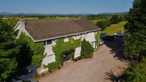 an aerial view of a house with ivy at Southpark House in Dumfries