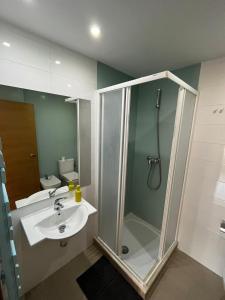 a bathroom with a shower and a sink at Javalambre Mountain Superski in Camarena de la Sierra