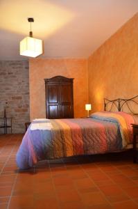 a bedroom with a bed in a room at B&B La casa di Giulietta in Castelmezzano