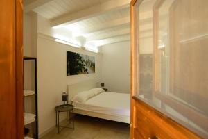 Postel nebo postele na pokoji v ubytování Le Dimore di Mariuccia Relax & SPA